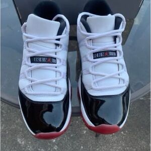 Air Jordan 11 Retro Low Black, White, and Red Sneakers